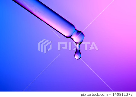 Premium serum droplet falling from pipette for healthy skin Premium serum droplet falling from pipette for healthy skin 140811372