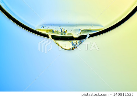 Advanced skincare serum droplet applying to glass surface Advanced skincare serum droplet applying to glass surface 140811525