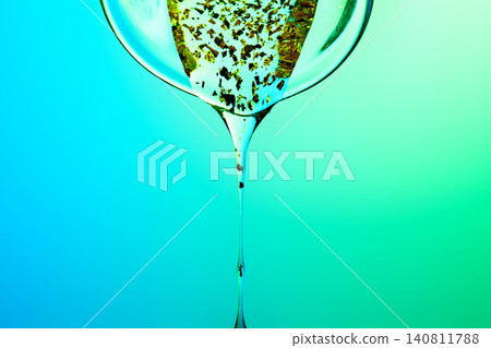 Biotech serum fluid dripping with gold flakes Biotech serum fluid dripping with gold flakes 140811788