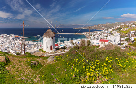 Traditional windmill overlooking Mykonos Town and harbor on Mykonos Island, Greece Traditional windmill overlooking Mykonos Town and harbor on Mykonos Island, Greece 140811833