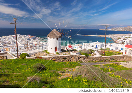 Traditional windmill overlooking Mykonos Town and harbor on Mykonos Island, Greece Traditional windmill overlooking Mykonos Town and harbor on Mykonos Island, Greece 140811849