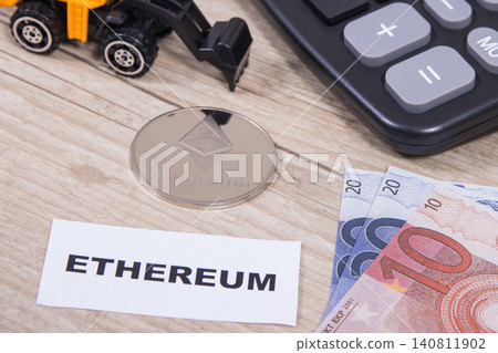 Ethereum coin, euro bills, miniature excavator and calculator Ethereum coin, euro bills, miniature excavator and calculator 140811902