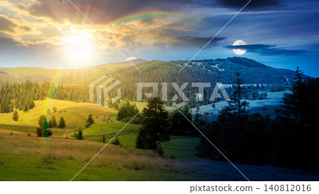 mountainous countryside landscape in summer. day meet night. sun and moon over view of green rural scenery with grassy pastures and rolling forested hills. wonderful mountain weather with cloudy sky 140812016