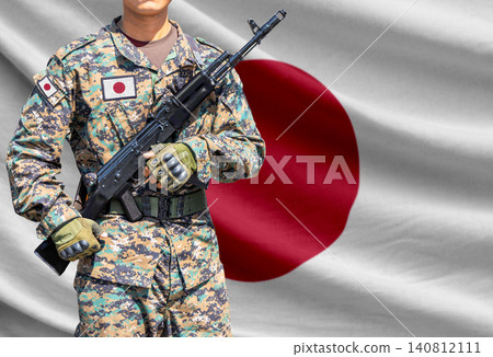 Japan flag with soldier holding assault rifle Japan flag with soldier holding assault rifle 140812111