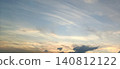 Delicate, flowing cirrus clouds and a soft, gradient evening sky. 140812122
