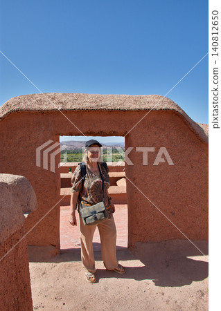 A senior tourist enjoys her trip visiting the terraces of the historic Taourirt Kasbah in Morocco A senior tourist enjoys her trip visiting the terraces of the historic Taourirt Kasbah in Morocco 140812650