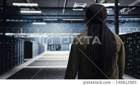 Data center manager conducts security audits in a data center to reduce cyber threats and compliance errors. Data center manager conducts security audits in a data center to reduce cyber threats and compliance errors. 140812985