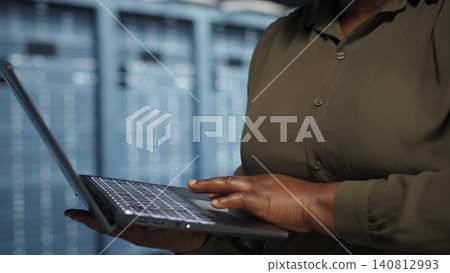 Data center manager guides programmers as they troubleshoot a critical AI system error and software glitch. 140812993