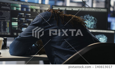 Data center engineer reacts to malfunctioning software and technical errors inside a server room. 140813017