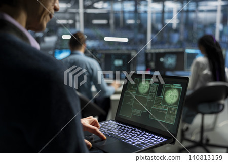 System administrator provides technical support from a data center using a headset while troubleshooting client server issues. System administrator provides technical support from a data center using a headset while troubleshooting client server issues. 140813159