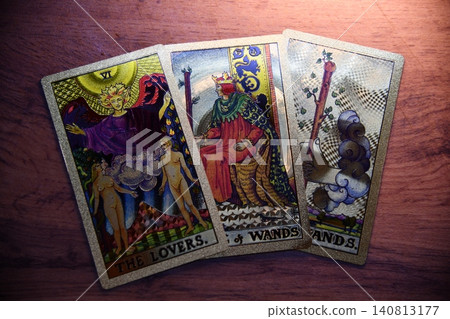 Hand holding tarot card with candlelight on the darkness background for Astrology Occult Magic illustration - Magic 140813177
