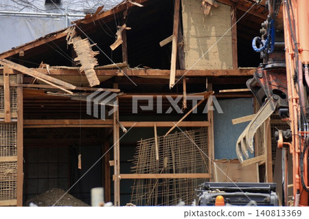 A wooden house that has been demolished, with the rooms completely exposed. A wooden house that has been demolished, with the rooms completely exposed. 140813369