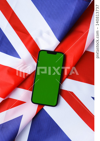 Green smartphone phone chromakey screen National symbol of Great Britain. Mock up advertisement template UK wave British fabric flag background. Copy space for your text. Independence Green smartphone phone chromakey screen National symbol of Great Britain. Mock up advertisement template UK wave British fabric flag background. Copy space for your text. Independence 140813737