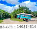 A landscape of water buffalo carts and subtropical plants on Yubu Island in the Yaeyama Islands of Okinawa Prefecture. 140814614