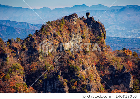 View of the autumn foliage of Ura-Myogi, the rocky peaks of Choto-no-Atama, and the Kōkaizan and Nikko mountain ranges. View of the autumn foliage of Ura-Myogi, the rocky peaks of Choto-no-Atama, and the Kōkaizan and Nikko mountain ranges. 140815016
