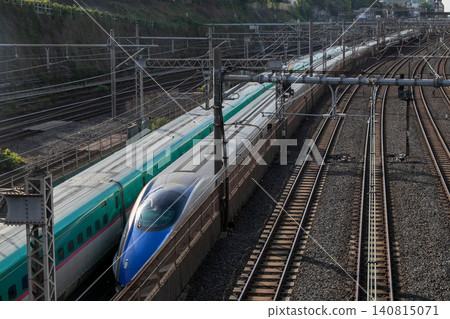 Tohoku-Hokuriku Shinkansen trains passing each other Tohoku-Hokuriku Shinkansen trains passing each other 140815071