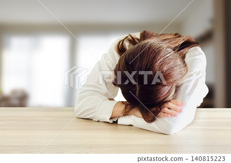 A woman who fells to her desk A woman who fells to her desk 140815223