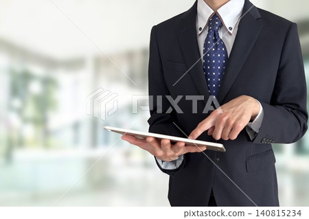 A man holding a tablet 140815234