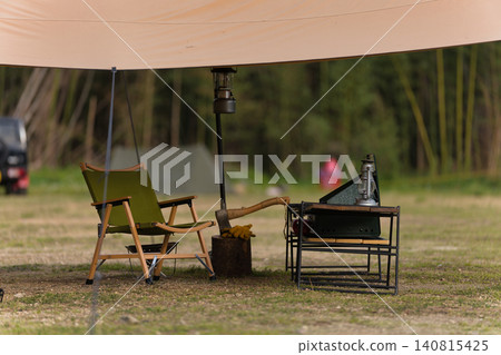 A solo camping tent site surrounded by nature in the mountains A solo camping tent site surrounded by nature in the mountains 140815425