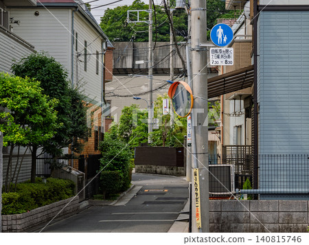 A residential alleyway with a pedestrian-only sign. A residential alleyway with a pedestrian-only sign. 140815746