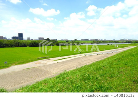 A view of the riverbank with a soccer field, seen from the Edogawa River embankment during a break in the rainy season in early summer. A view of the riverbank with a soccer field, seen from the Edogawa River embankment during a break in the rainy season in early summer. 140816132