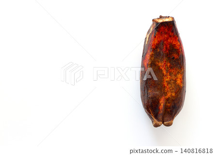 Blackened twin bananas viewed from directly above against a white background. Blackened twin bananas viewed from directly above against a white background. 140816818