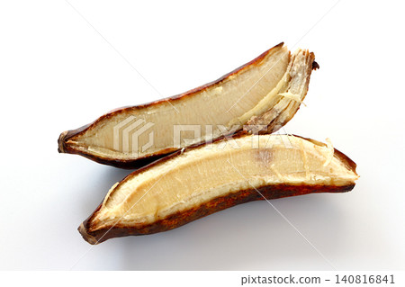 Blackened twin bananas against a white background. Blackened twin bananas against a white background. 140816841