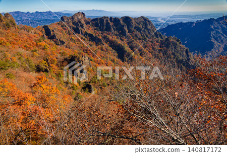 Autumn foliage on the rocky peaks of Ura-Myogi, with views of Mt. Haruna, the Nikko mountain range, and the Kanto Plain. Autumn foliage on the rocky peaks of Ura-Myogi, with views of Mt. Haruna, the Nikko mountain range, and the Kanto Plain. 140817172