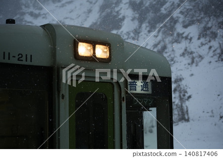 A local train running through the snow A local train running through the snow 140817406