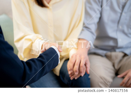 Asian couple in living room at home consulting with psychologist for marriage therapy mental health. Asian couple in living room at home consulting with psychologist for marriage therapy mental health. 140817556