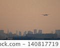 A plane landing at Haneda Airport via a route through central Tokyo. A plane landing at Haneda Airport via a route through central Tokyo. 140817719