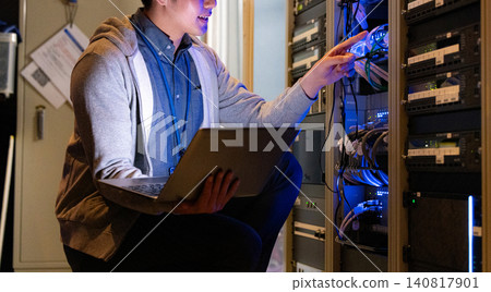 Engineers working in a data center. Photo courtesy of Sky Perfect Tokyo Media Center. Engineers working in a data center. Photo courtesy of Sky Perfect Tokyo Media Center. 140817901