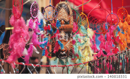 Indian market stall with traditional wood mask and colorful dreamcatchers for sale Indian market stall with traditional wood mask and colorful dreamcatchers for sale 140818331