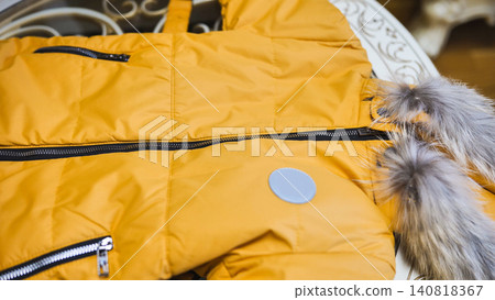 Yellow puffer jacket with faux fur hood, essential winter outerwear for cold season Yellow puffer jacket with faux fur hood, essential winter outerwear for cold season 140818367