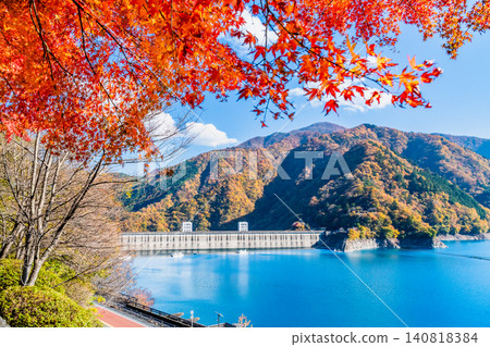 Lake Okutama in Tokyo is ablaze with autumn colors. Lake Okutama in Tokyo is ablaze with autumn colors. 140818384