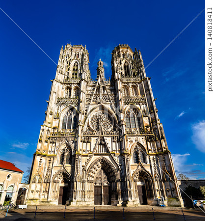 View of the stunning Gothic architecture and twin towers of Saint Stephen Cathedral against a clear blue sky in Toul, France. View of the stunning Gothic architecture and twin towers of Saint Stephen Cathedral against a clear blue sky in Toul, France. 140818411