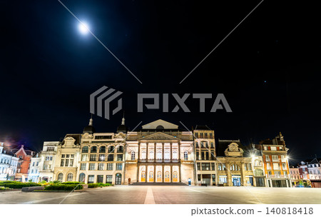 The illuminated facade of Theater Jean Vilar on a clear night under a full moon in the historic center of Saint-Quentin, France. 140818418