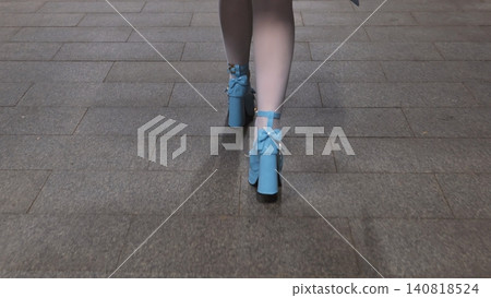 Woman walking on pavement with light blue high heel shoes and white stockings Woman walking on pavement with light blue high heel shoes and white stockings 140818524