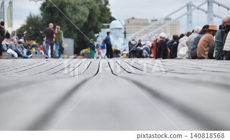 Gorky Park wooden decking with people resting and walking, blurring the background Gorky Park wooden decking with people resting and walking, blurring the background 140818568