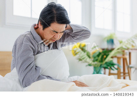 Seniors experiencing headaches upon waking up; feeling unwell. Seniors experiencing headaches upon waking up; feeling unwell. 140819343