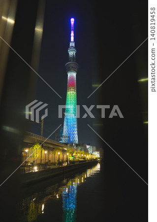 The beautiful reflection on the river surface and the night view of Tokyo Skytree towering against the night sky. The beautiful reflection on the river surface and the night view of Tokyo Skytree towering against the night sky. 140819458