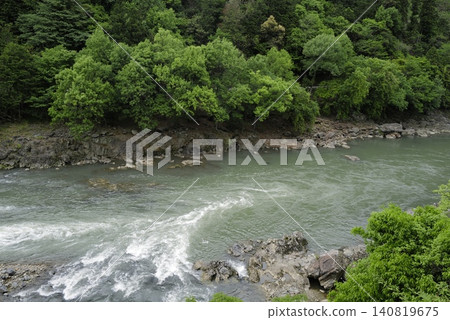 The Hozugawa River as seen from the Sagano Scenic Railway. The Hozugawa River as seen from the Sagano Scenic Railway. 140819675