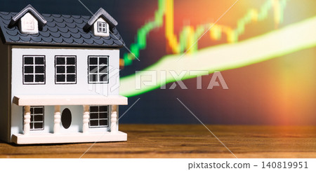 Real estate market growth and property investment concept. Miniature house with rising financial chart background. Real estate market growth and property investment concept. Miniature house with rising financial chart background. 140819951