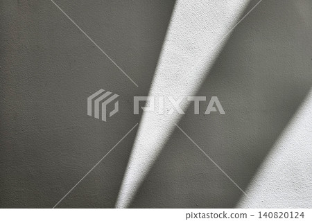 Sunlight Casting Sharp Abstract Shadows on Textured Gray Concrete Wall, Minimalist Architectural Background for Modern Interior Design. Sunlight Casting Sharp Abstract Shadows on Textured Gray Concrete Wall, Minimalist Architectural Background for Modern Interior Design. 140820124