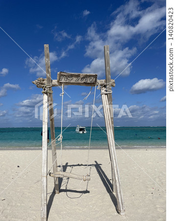 Kumejima Island: Swings at Hatenohama Beach and the blue sea Kumejima Island: Swings at Hatenohama Beach and the blue sea 140820423