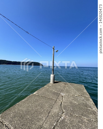 Pier extending into the sea 140820473