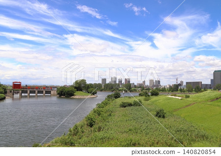 Summer view of the Arakawa River: Looking upstream from the Shin-Iwabuchi Floodgate (Kita Ward, Tokyo) Summer view of the Arakawa River: Looking upstream from the Shin-Iwabuchi Floodgate (Kita Ward, Tokyo) 140820854