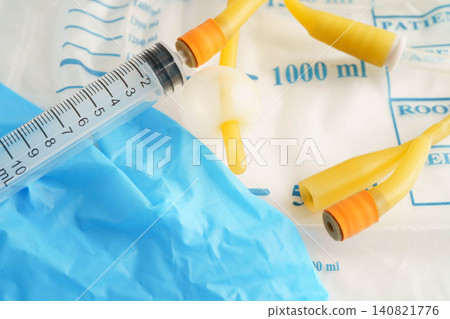 Foley catheter and urine drainage bag collect urine for disability or patient in hospital. Foley catheter and urine drainage bag collect urine for disability or patient in hospital. 140821776