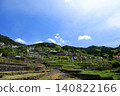 A scene of terraced rice paddies in fallow fields in early summer, with carp streamers flying. 140822166