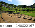 A scene of terraced rice paddies in fallow fields in early summer, with carp streamers flying. 140822167